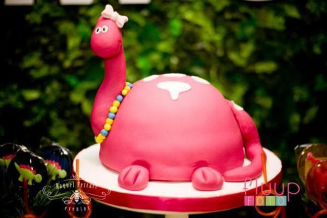 pink dinosaur birthday cake