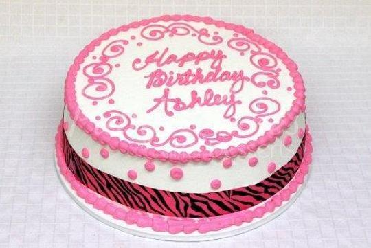 round pink birthday cake
