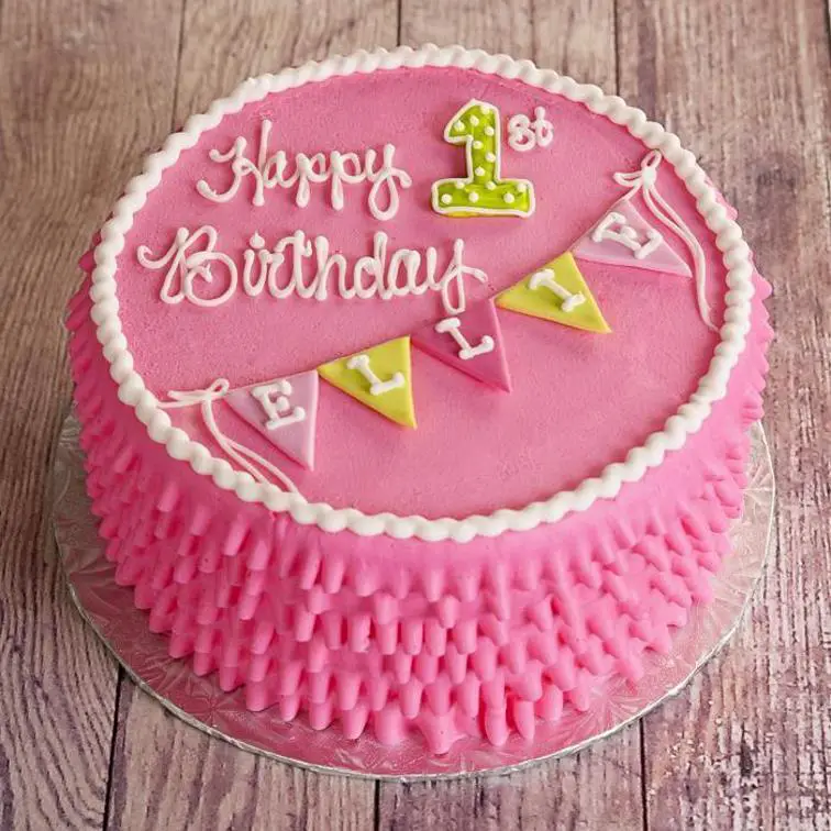 round pink birthday cake