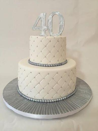 silver and white birthday cakes